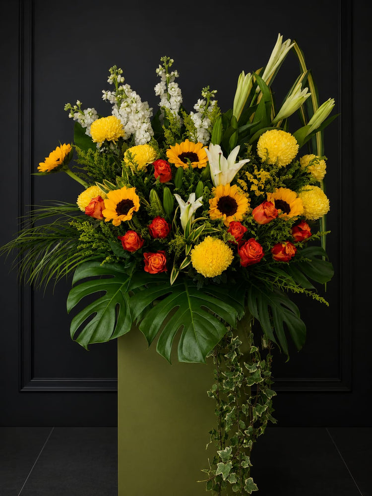 Sunflower condolence standee with "Eternal Sunshine Sympathy" message, decorated with vibrant yellow sunflowers by FlowerPlus花加.