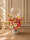 Colorful pastel gerbera daisies in a FlowerPlus Bloom Box, showcasing vibrant blooms and fresh floral arrangement.